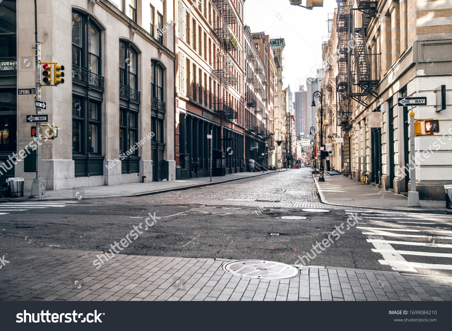 Empty street at sunset time in SoHo district in Manhattan, New York #1699084210