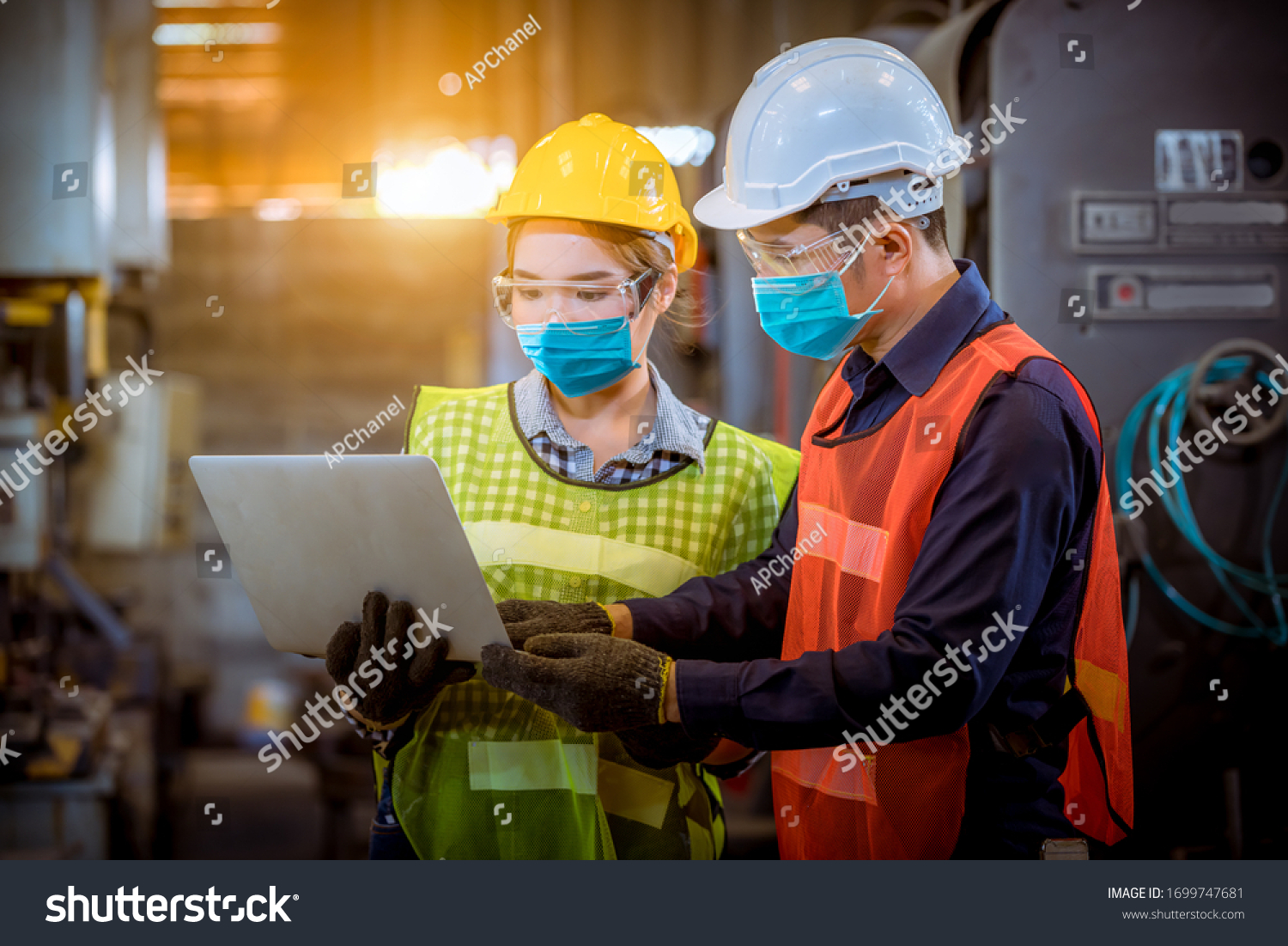 Portrait woman worker and engineer under inspection and checking production process on factory station by wearing safety mask to protect for pollution and virus in factory. #1699747681