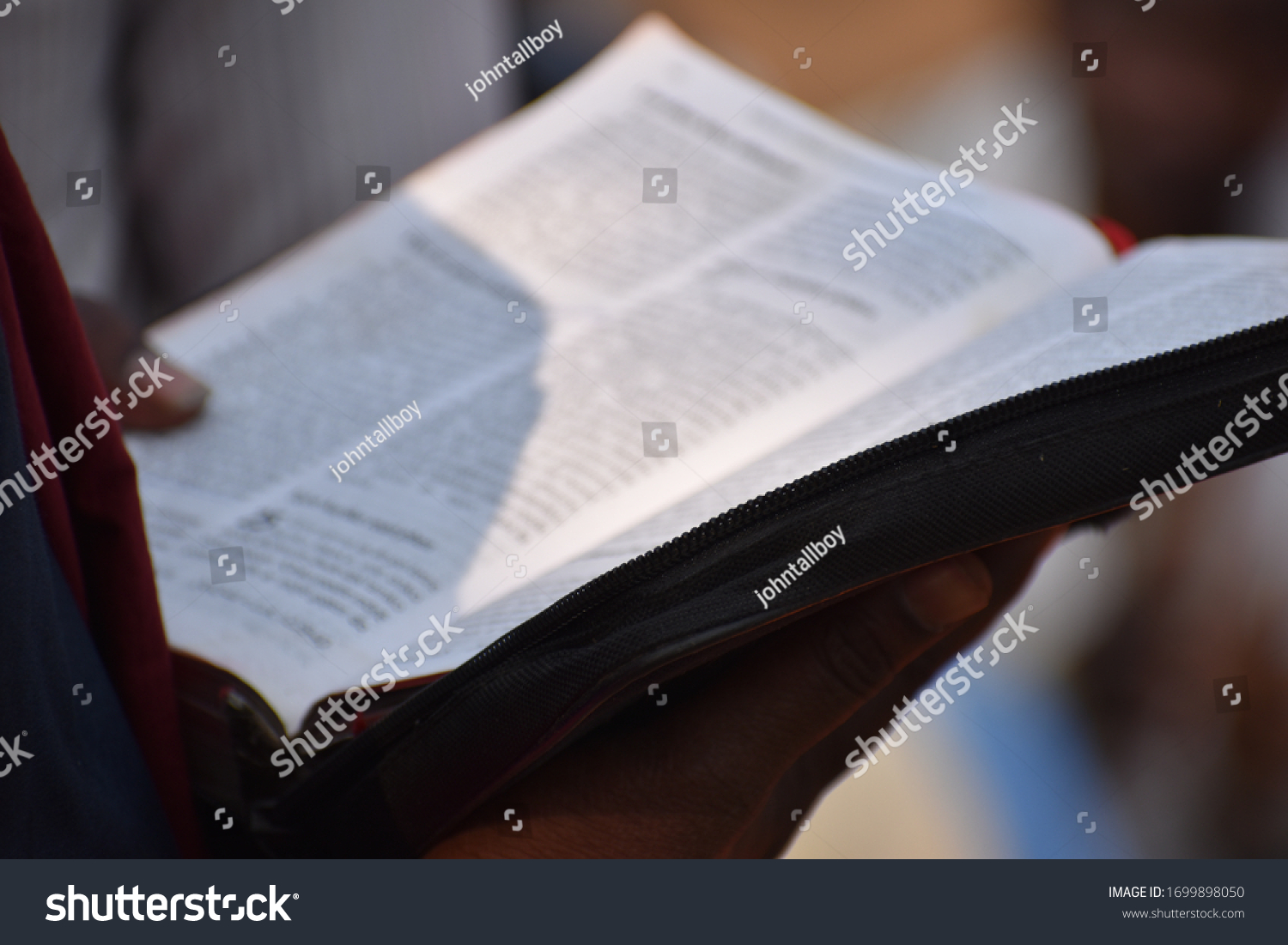 Indian language Bible reading closeup  #1699898050