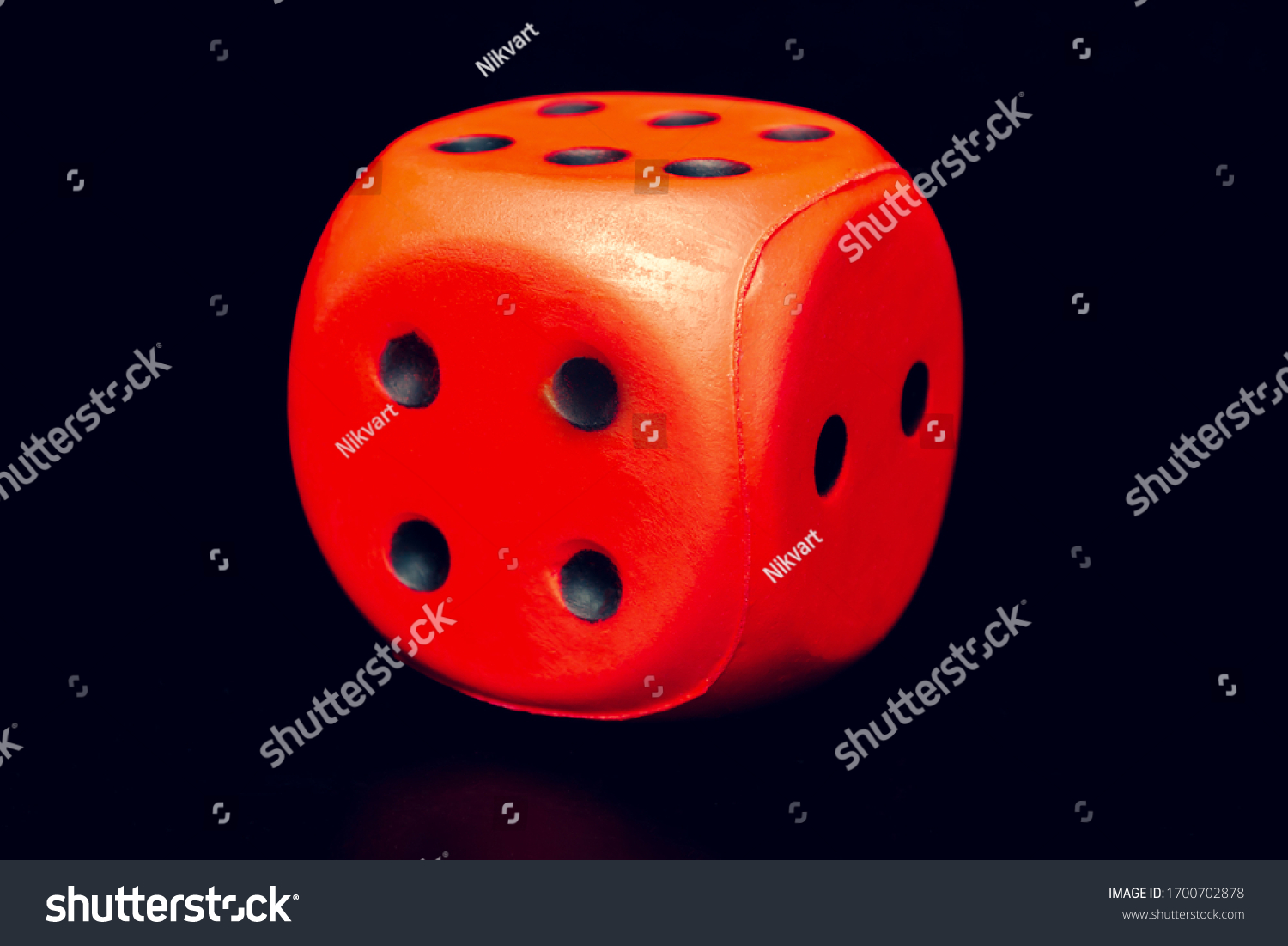Big dice of red color on a black background #1700702878