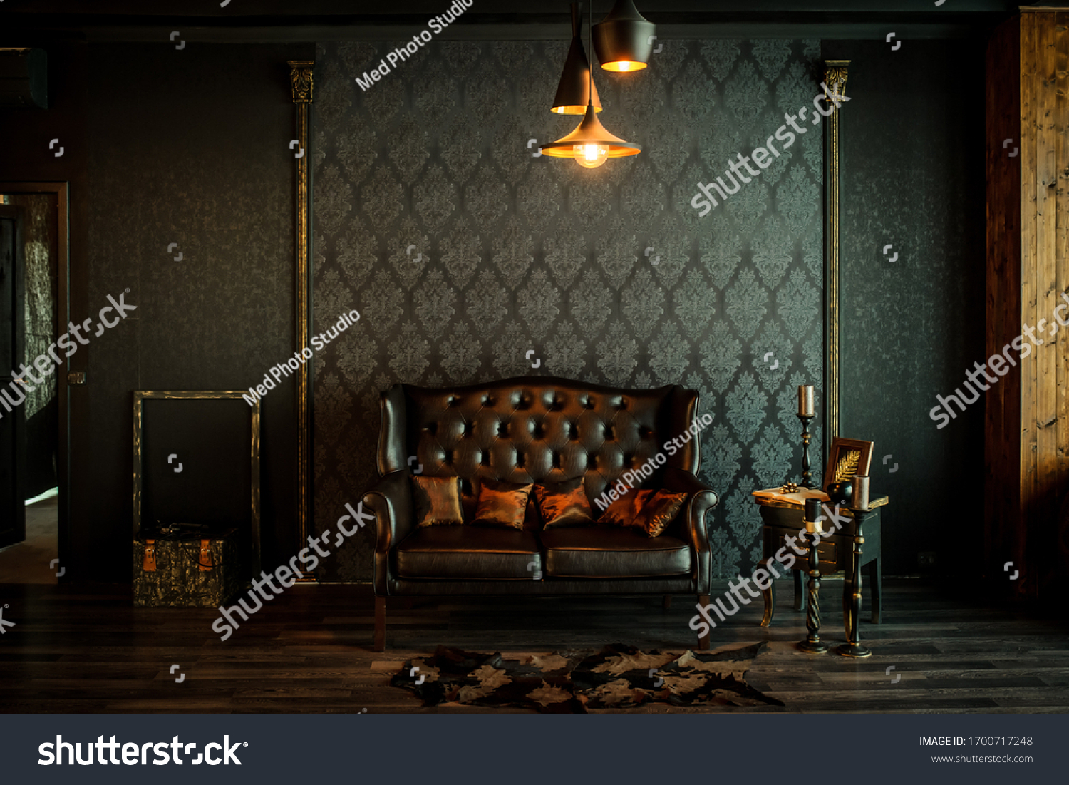 Old vintage interior with leather sofa, wood table and ceiling light. #1700717248
