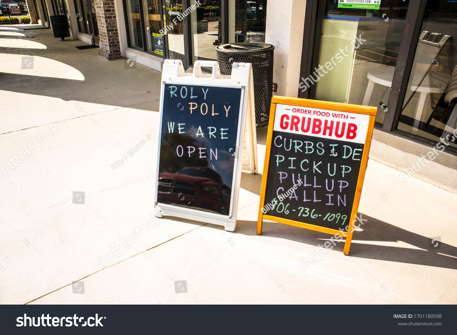 Augusta, Ga USA April 1 2020: Roly Poly sandwich restaurant signs open during pandemic #1701180598