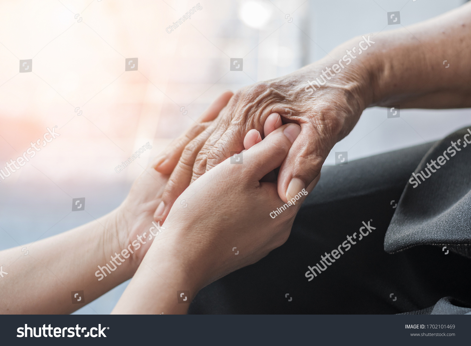 Parkinson disease patient, Alzheimer elderly senior, Arthritis person's hand in support of nursing family caregiver care for disability awareness day, National care givers month, ageing society  #1702101469