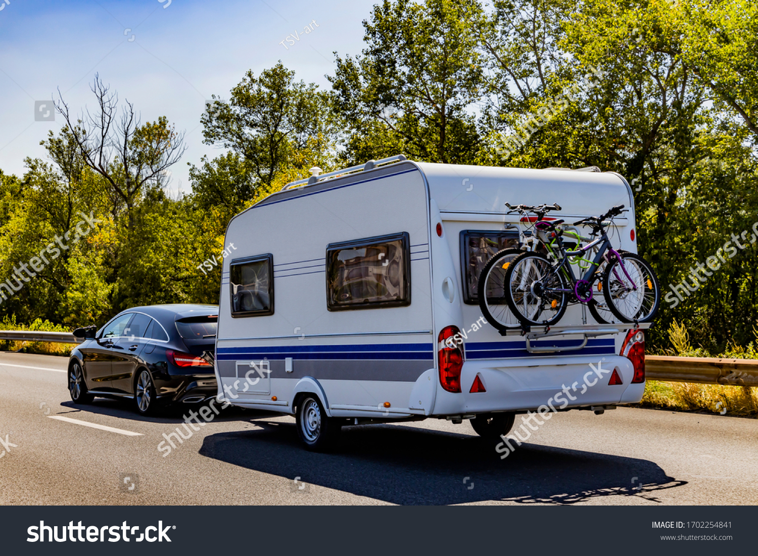 Caravan trailer on a freeway road. #1702254841