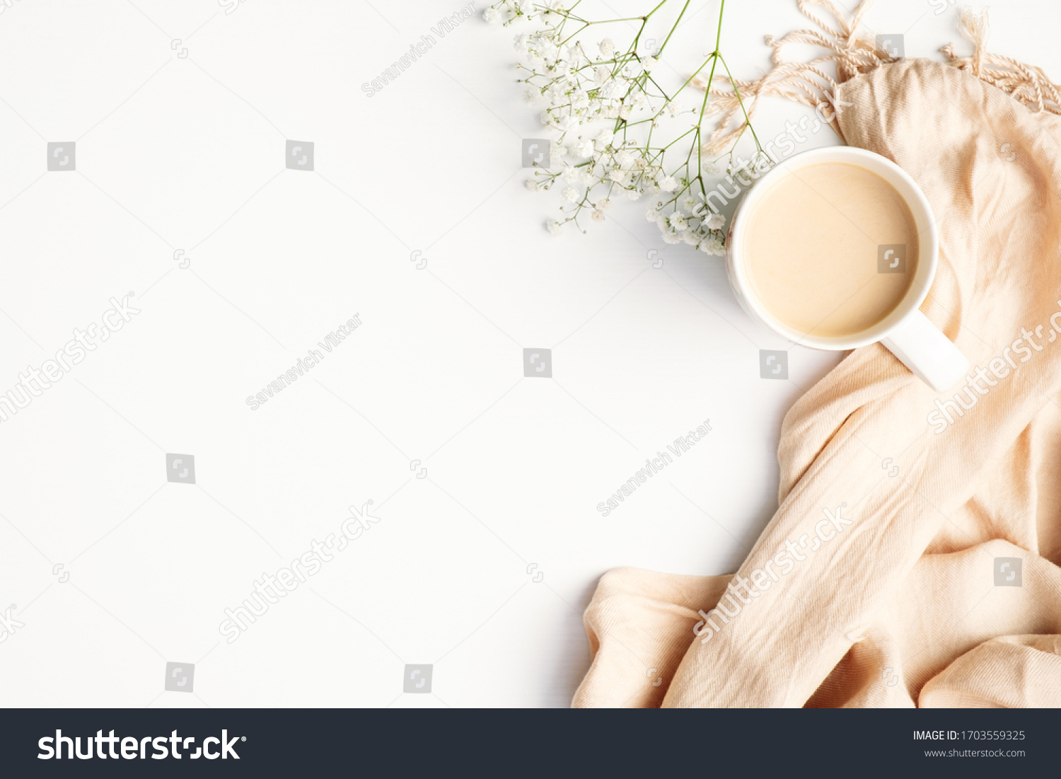 Flat lay plaid and cup of coffee on white desk. Hygge, autumn cozy mood, comfort concept. Flat lay, top view #1703559325