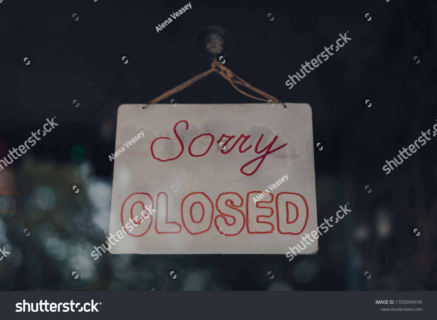 "Sorry we are closed" sign in a window of a cafe in London, UK. #1703994934