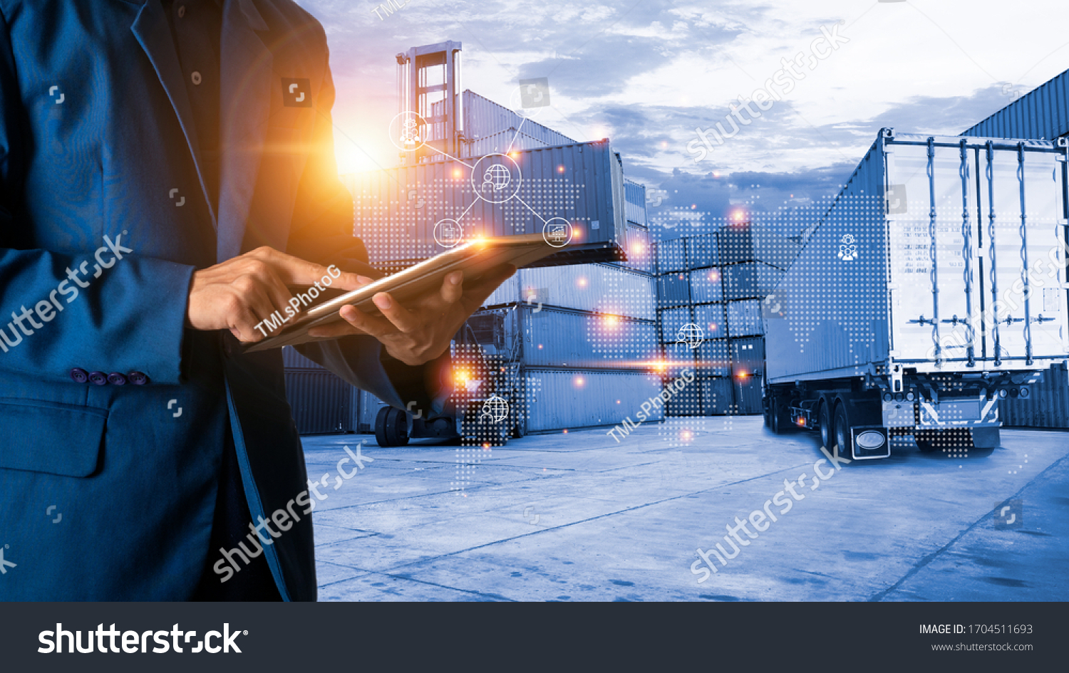 Global logistic or world of logistic concept. Businessman or manager using tablet standing with world map icon and shipping yard container and truck of transport background. fast or instant shipping. #1704511693