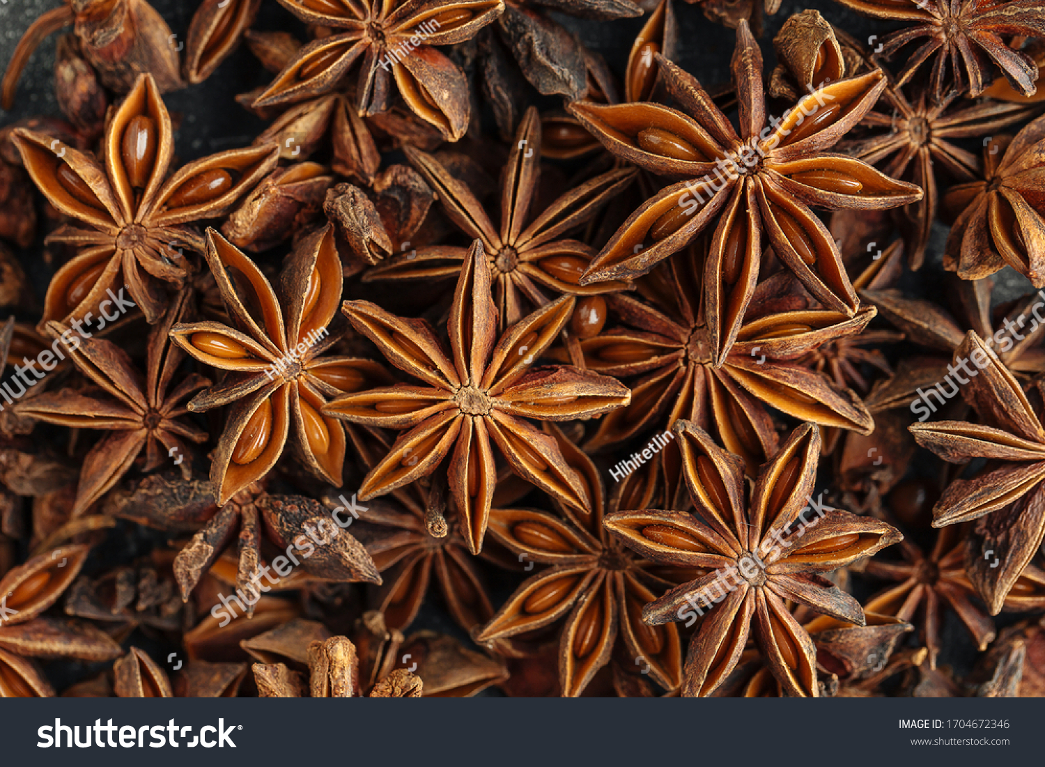 Top view closeup macro on fragrant spice anise, horizontal format #1704672346