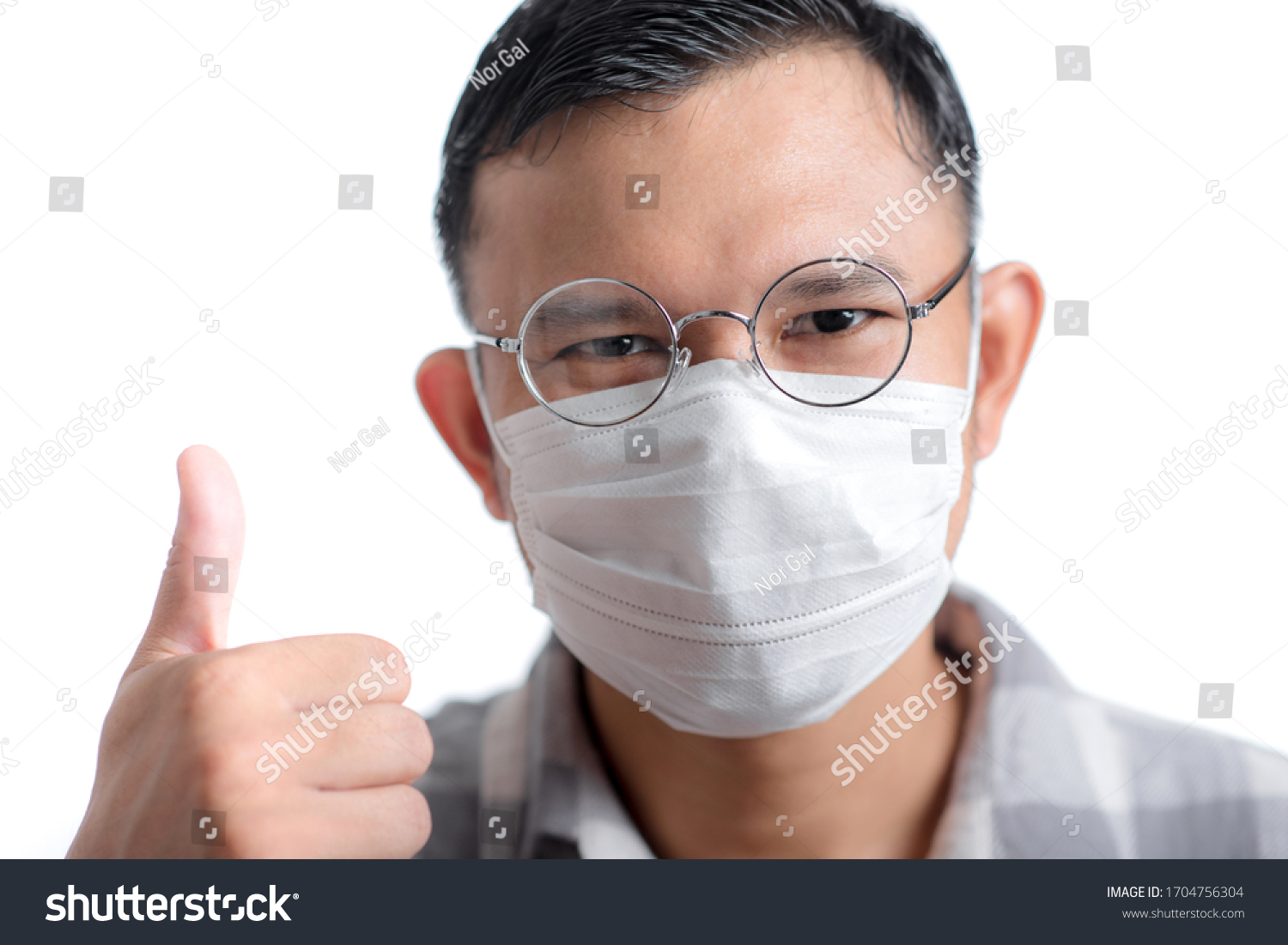 Asian man wearing the face mask against Coronavirus disease (COVID-19). #1704756304