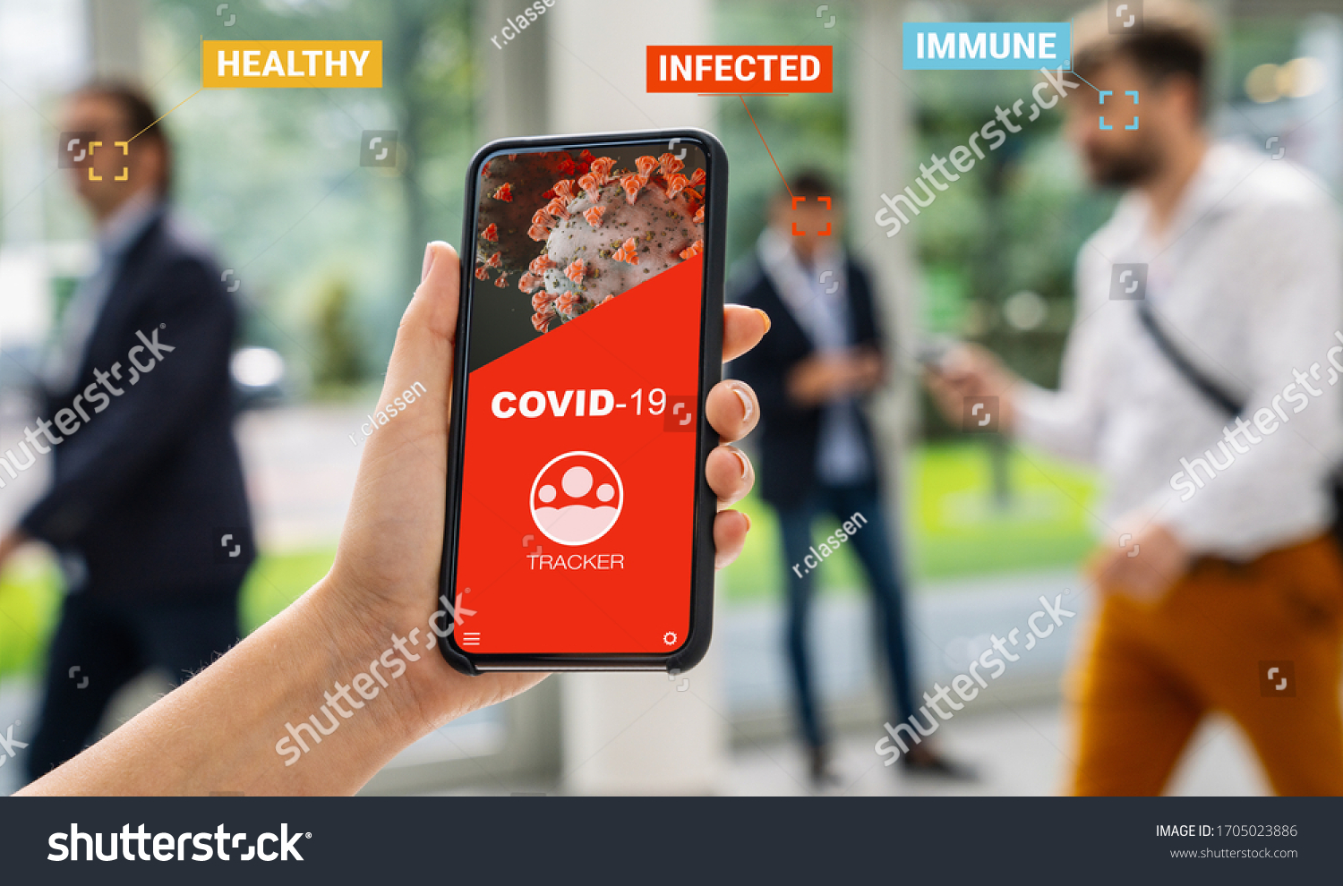 coronavirus tracking app on a mobile smartphone. Close up of woman tracking crowd of people in a smartphone screen application. Hand holding smart device. Mockup website. covid-19 corona virus tracker #1705023886
