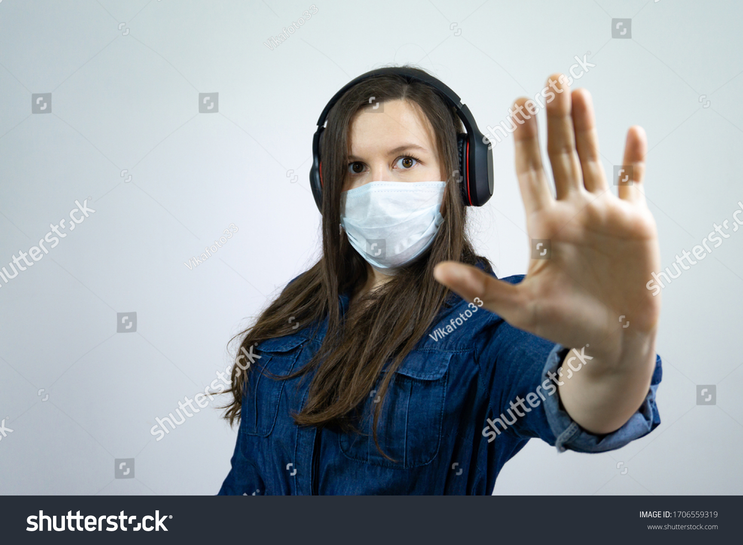 Help stop corona virus pandemic infectious disease outbreak. girl in mask with palm distance avoid communication #1706559319