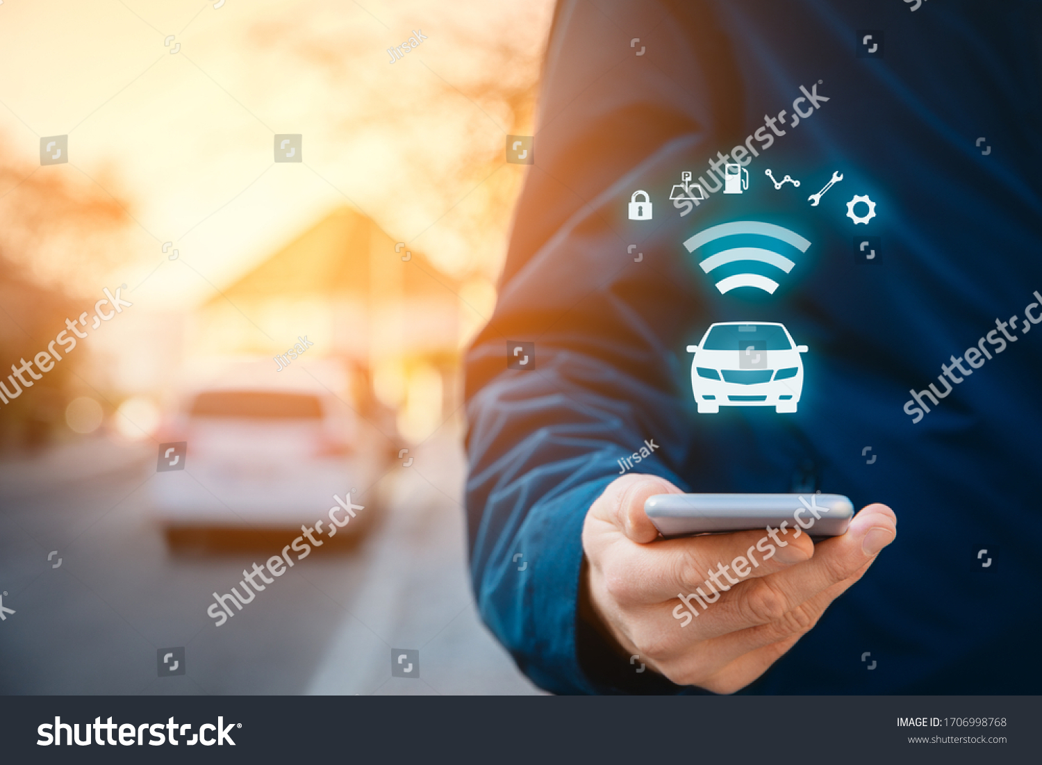 Intelligent car app on smart phone concept, intelligent vehicle and smart cars concept. Person with smart phone on street, car in background and wireless communication with car. #1706998768