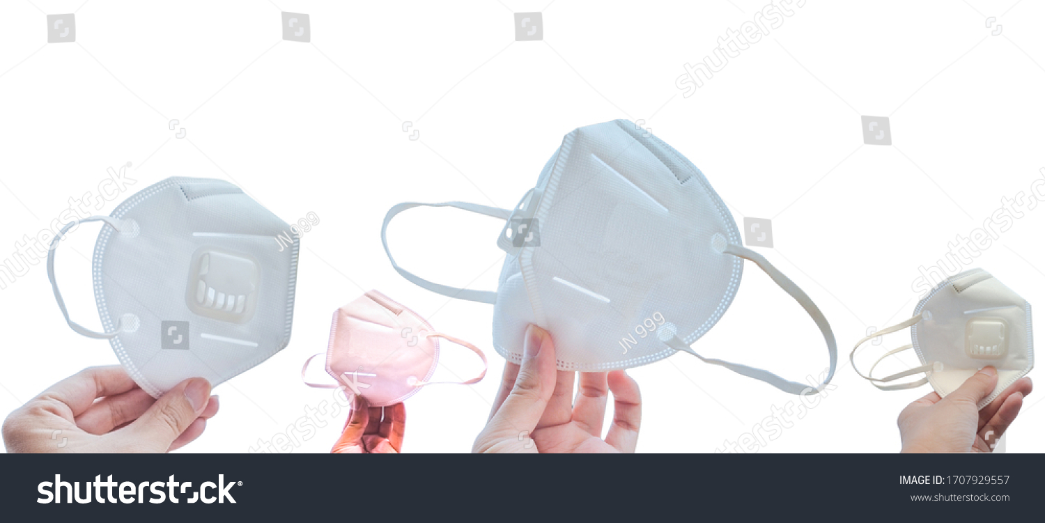 Hands holding different
side of n95 face mask for protect corona virus (covid-19) and pm2.5  on white background. #1707929557
