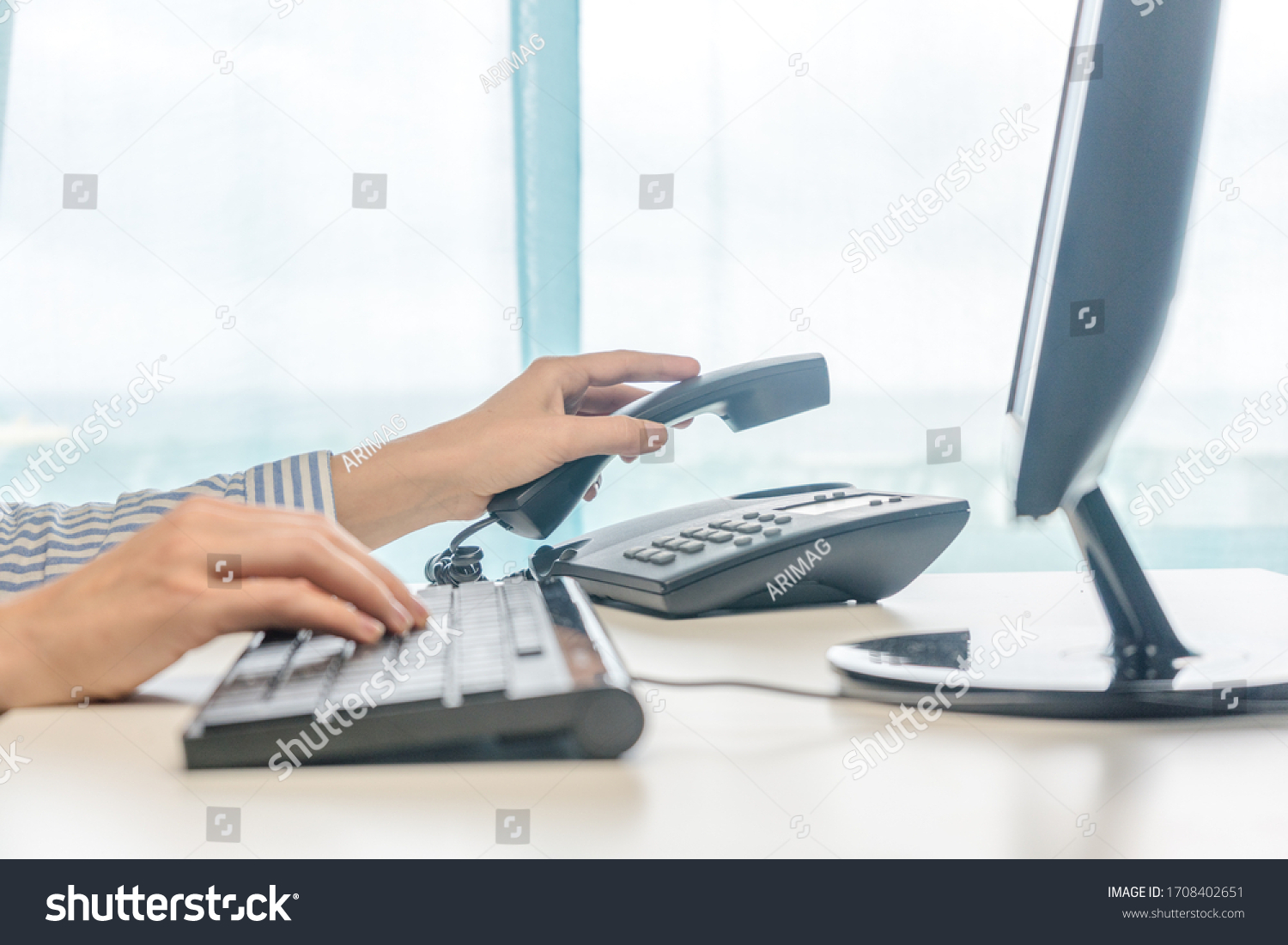 Female working, hands using computer telephone, closeup #1708402651