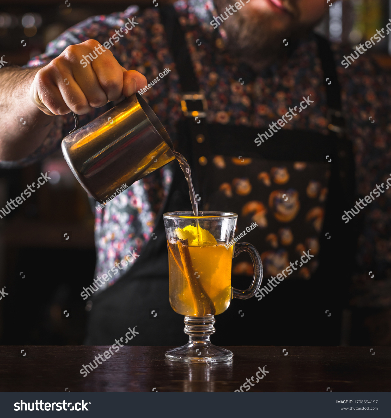bartender preparing classic hot toddy cocktail #1708694197