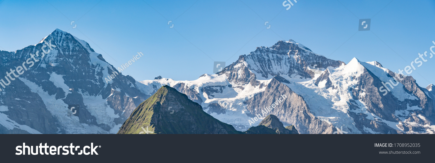 Switzerland, Panoramic view on Eiger, Monch and Jungfraujoch and green Alps around #1708952035