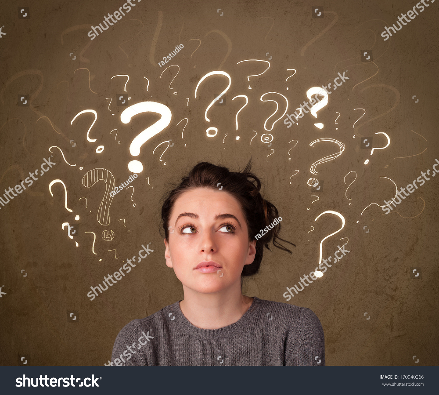 Teenage girl with question mark symbols around her head #170940266