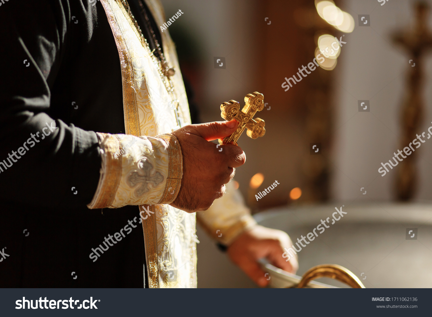 Russian Eastern orthodox church priest holds an orthodox cross in a hand. Close-up photo #1711062136