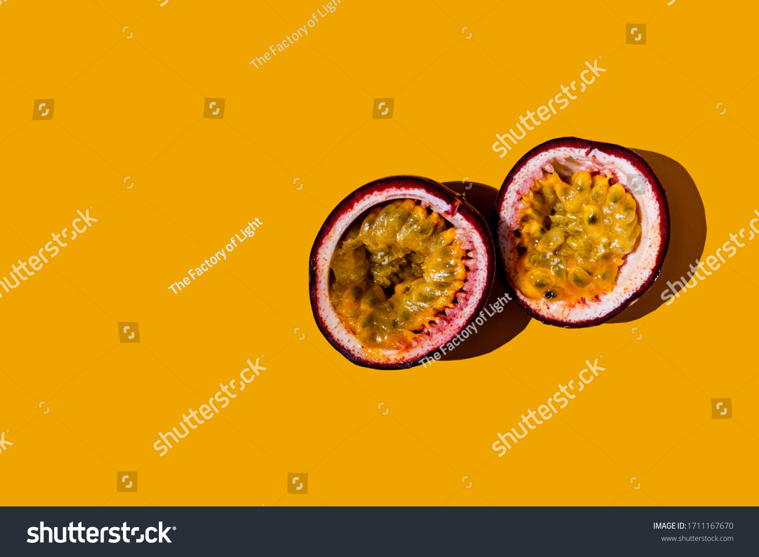 Cut passion fruit on a yellow background. #1711167670