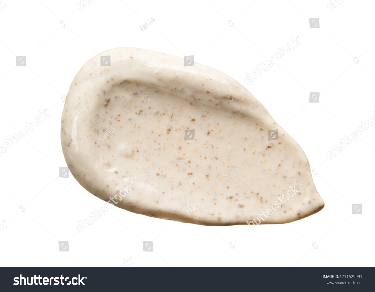 Face cream scrub smear swatch smudge isolated on white. Cosmetic exfoliation product. Beige coffee mask sample close-up #1711629991