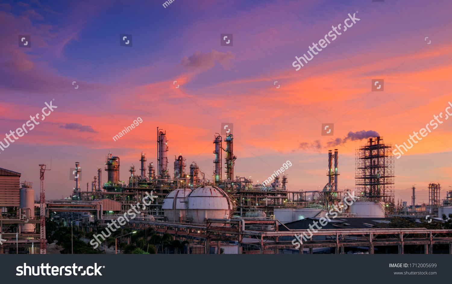 Oil and gas refinery plant or petrochemical industry on sky sunset background, Factory with evening, Manufacturing of petrochemical industrial #1712005699