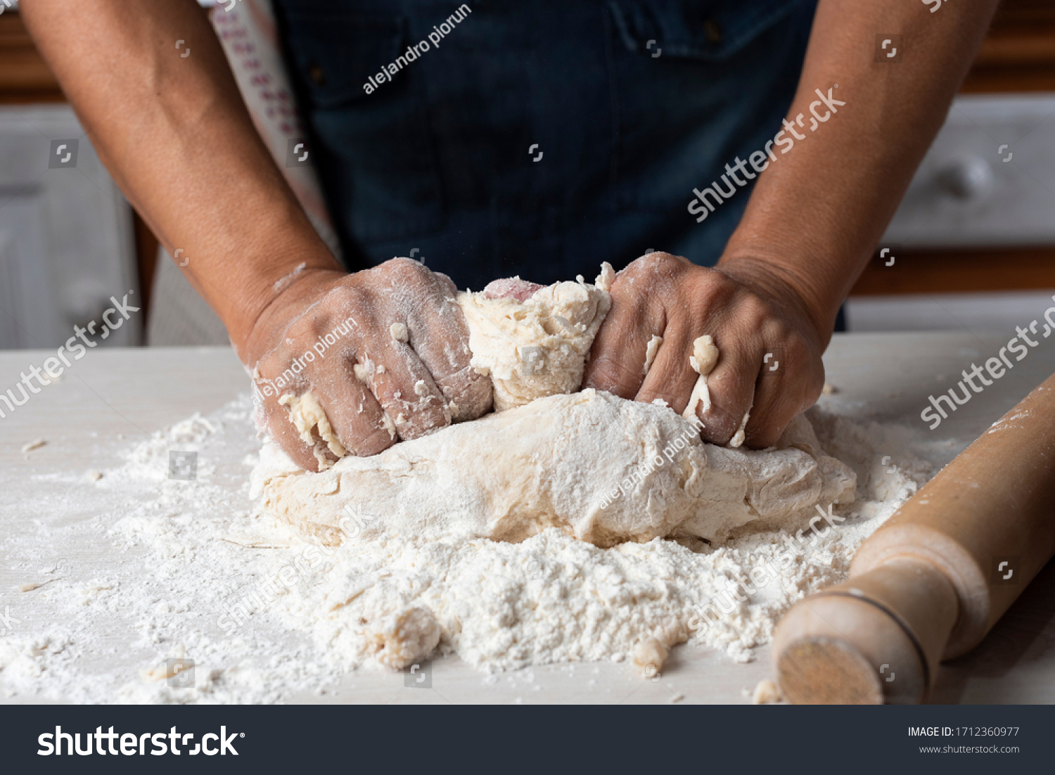 hands kneading flour, yeast eggs bakery ingredients milk honey in home kitchen #1712360977