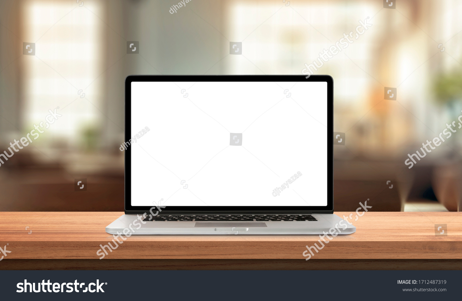 Laptop or notebook with blank screen on wood table in blurry background with house or office modern ,nature orange bokeh and sunlight in morning. #1712487319