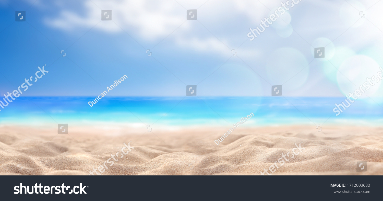 A summer vacation, holiday background of a tropical beach and blue sea and white clouds with sun flare. #1712603680