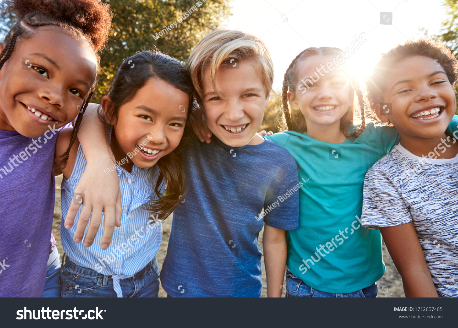 Portrait Of Multi-Cultural Children Hanging Out With Friends In Countryside Together #1712657485