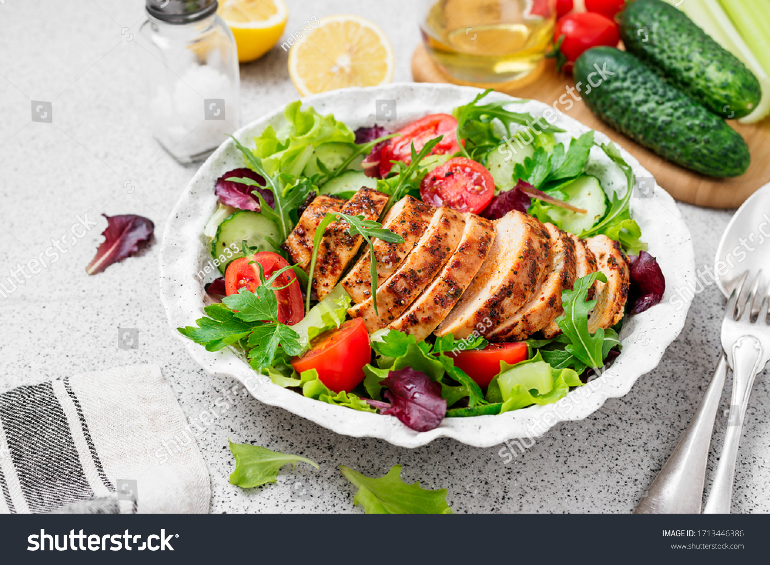 Grilled chicken breast, fillet and fresh vegetable salad. Healthy lunch menu. #1713446386