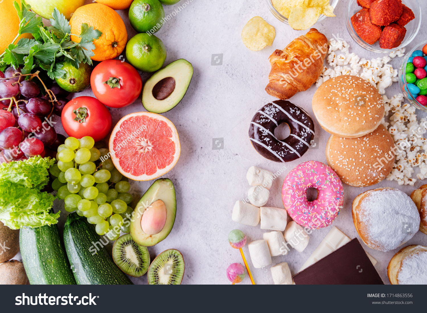 Healthy and unhealthy food concept. Top view of fast and sweet food vs fruit and vegetables #1714863556
