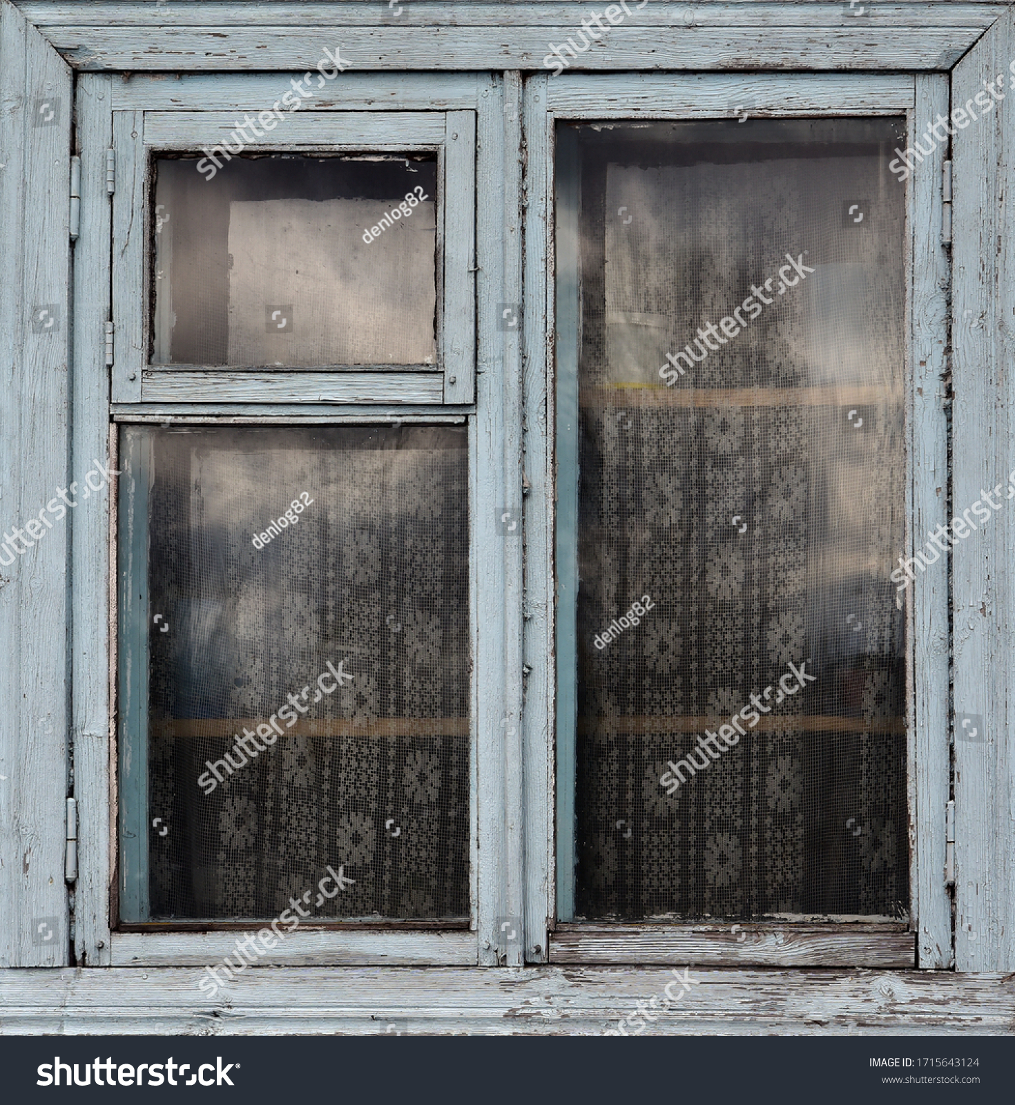 Old wooden window. Vintage frame texture with peeling paint. #1715643124