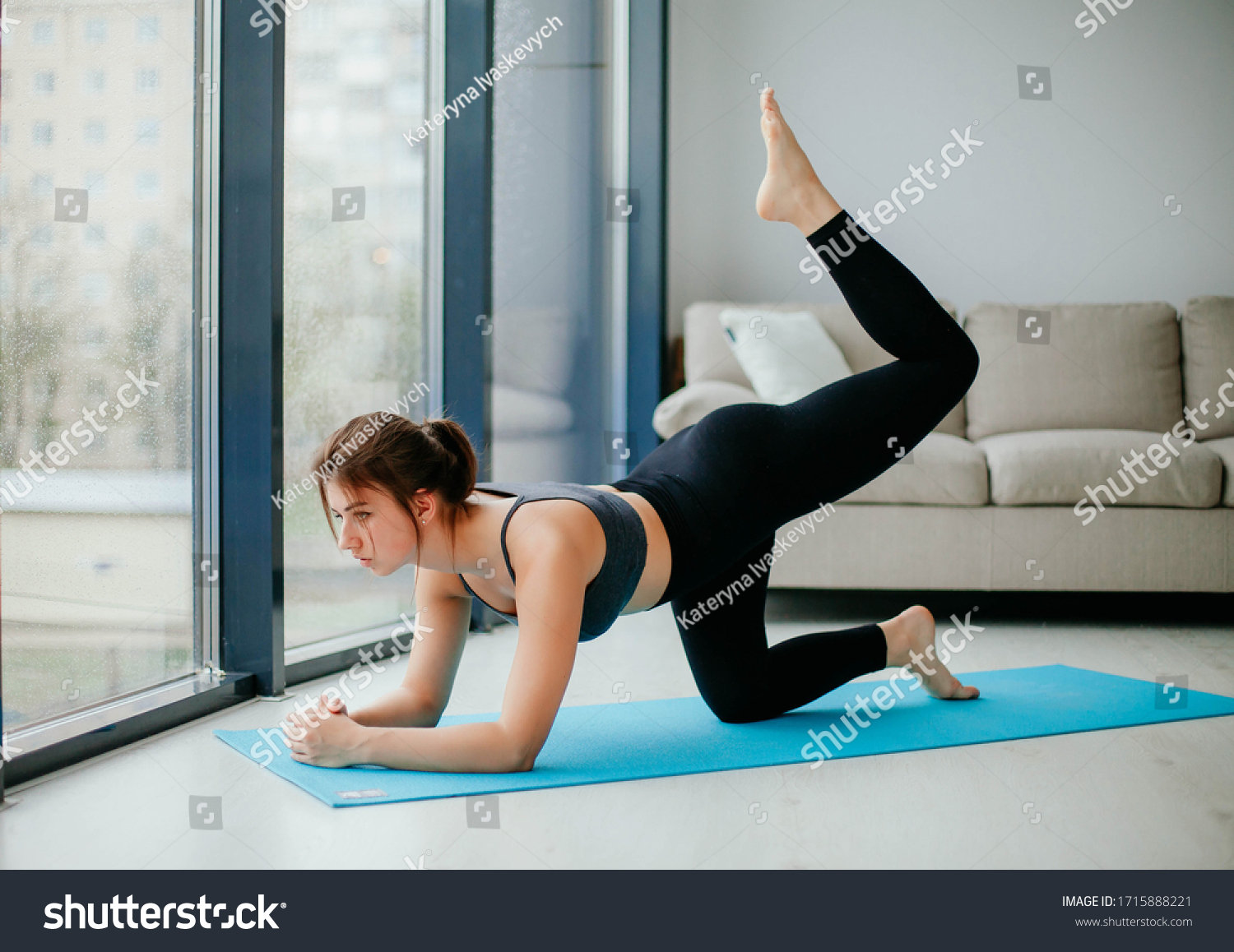 young woman doing fitness. sport at home.  #1715888221