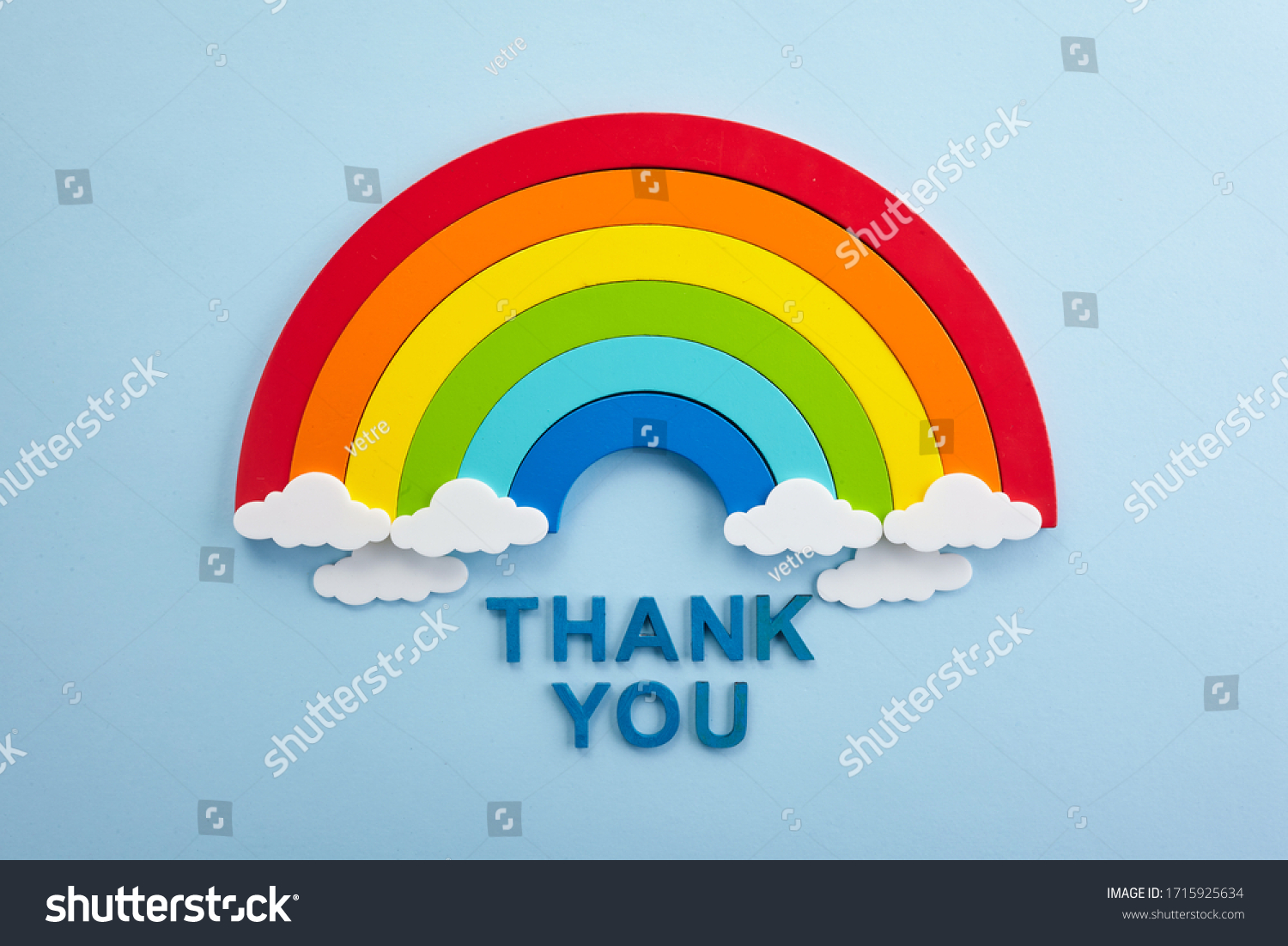 Thank you rainbow banner. Rainbow ob blue background with letters #1715925634