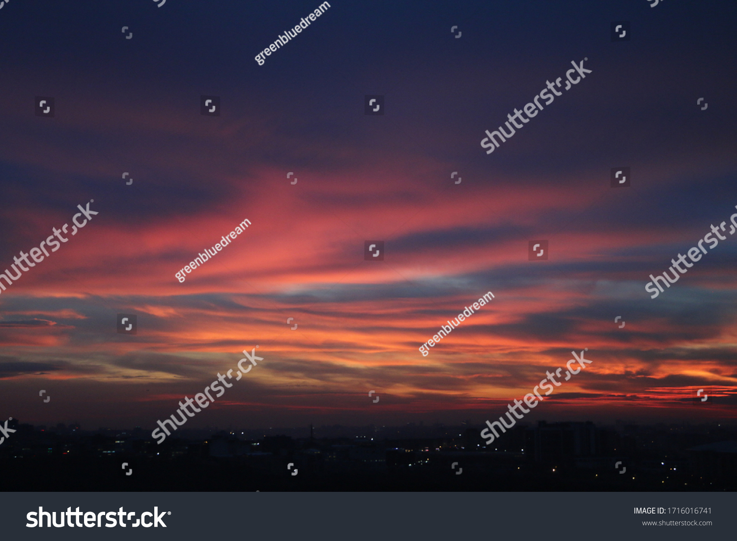Natural Sunset Sunrise Over Field Or Meadow. Bright Dramatic Sky And Dark Ground. Countryside Landscape Under Scenic Colorful Sky At Sunset Dawn Sunrise. Sun Over Skyline, Horizon. Warm Colours. #1716016741