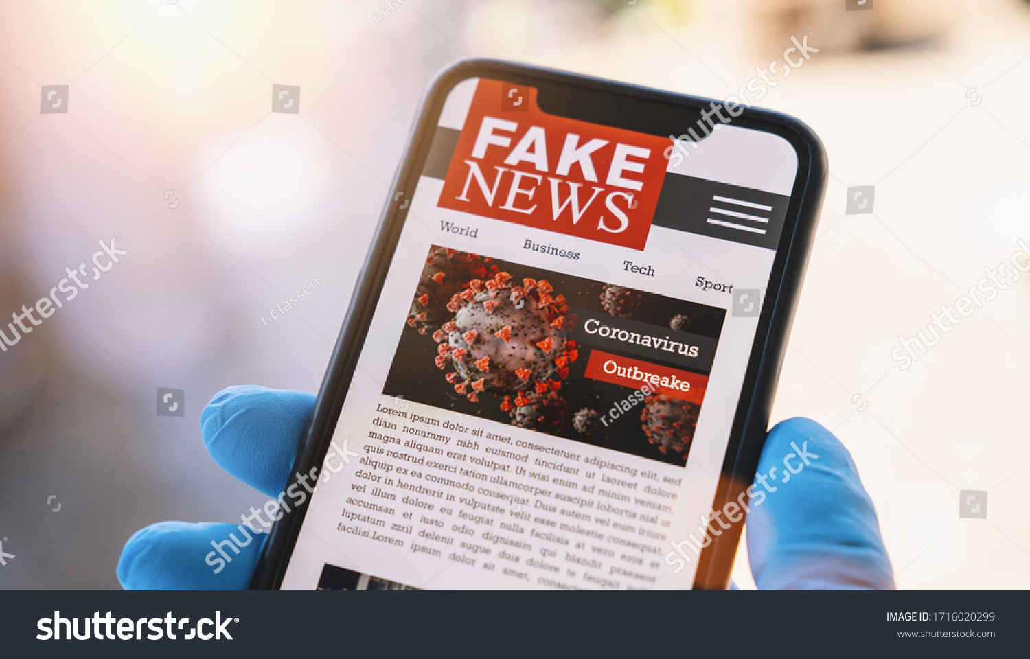 Online Corona Fake news on a mobile phone. Close up, man reading Fake news or articles about covid-19 in a smartphone screen application. Hand with gloves holding smart device. COVID19 nCov Outbreak. #1716020299