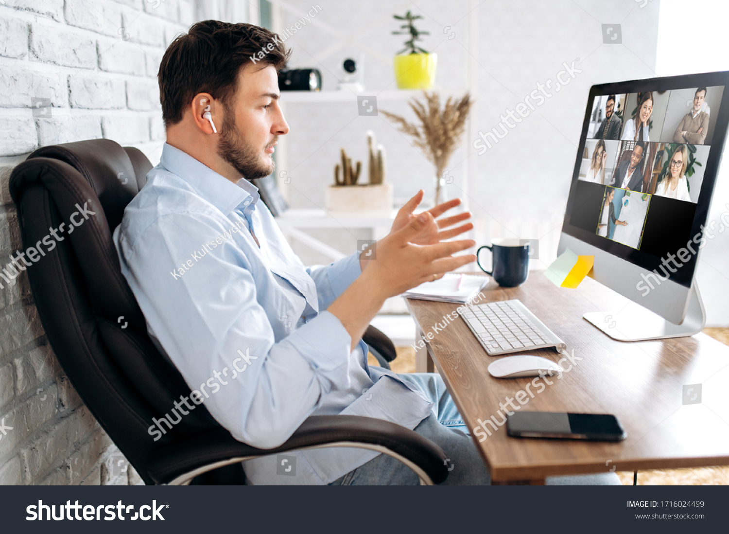 Zoom conference. Business partners communicate via video using laptop. The guy talks with his business partners appearance about plans and strategy. Distant work #1716024499