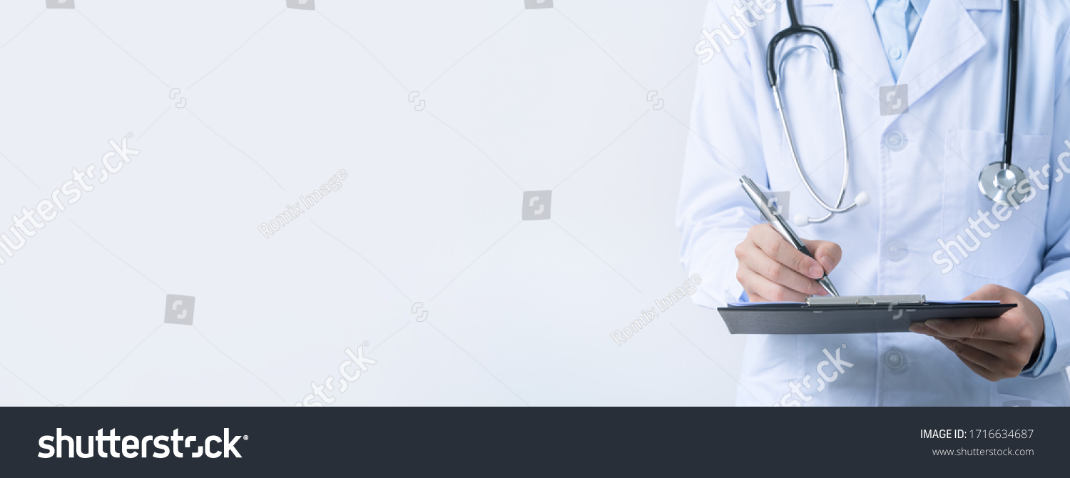 Doctor with stethoscope in white coat holding clipboard, writing medical record diagnosis, isolated on white background, close up, cropped view. #1716634687