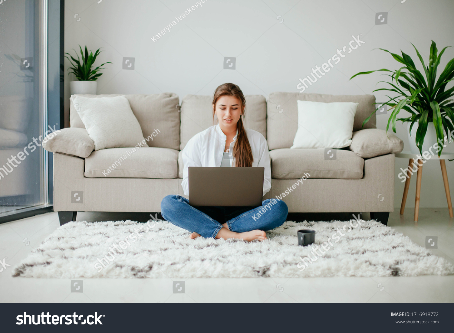 young woman working on laptop at home. work at home.  laptop. stay at home.  #1716918772