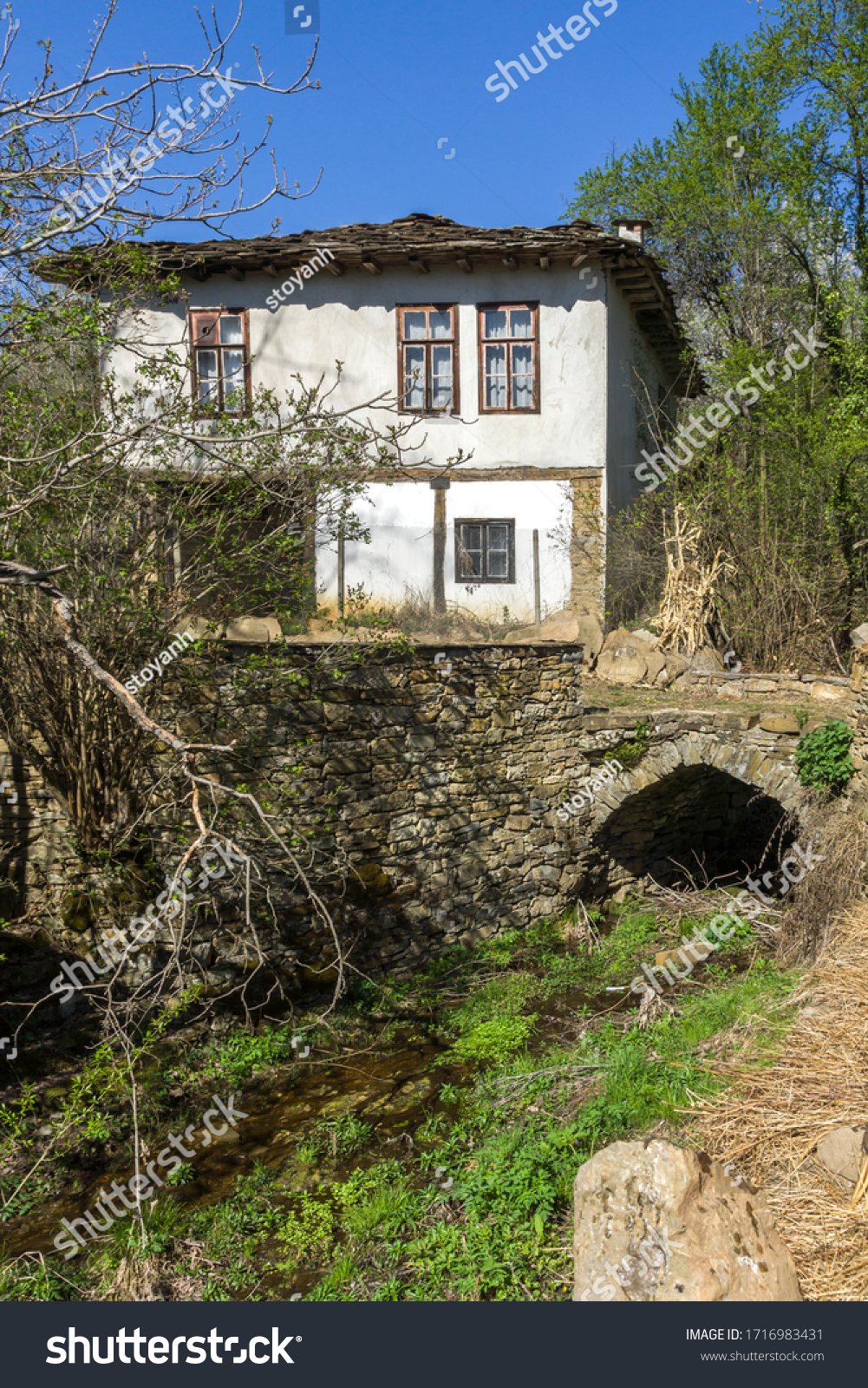 STARO STEFANOVO, BULGARIA - APRIL 9, 2014: Old houses at historical village of Staro Stefanovo, Lovech region, Bulgaria #1716983431