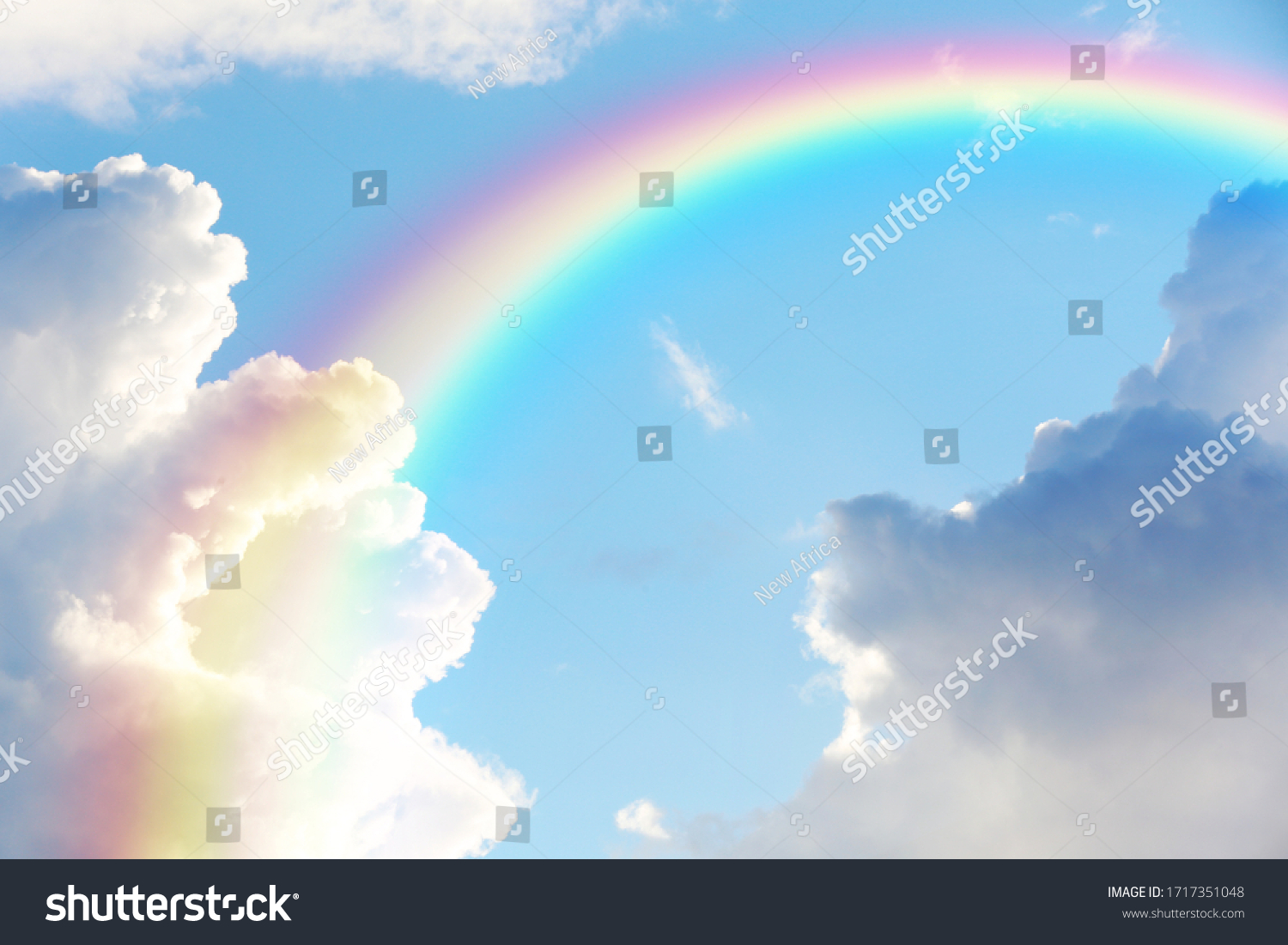 Picturesque view of beautiful rainbow and blue sky on sunny day  #1717351048