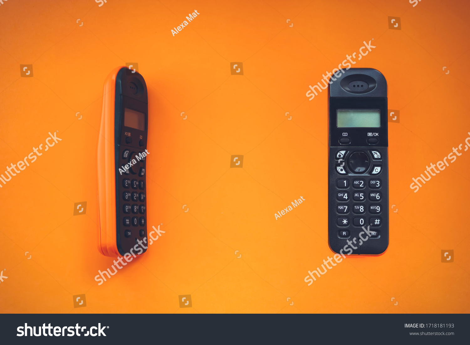 Two wireless cordless telephone, radiotelephone, dect cordless phone wireless phone, radiotelephone, radio phone on orange background #1718181193
