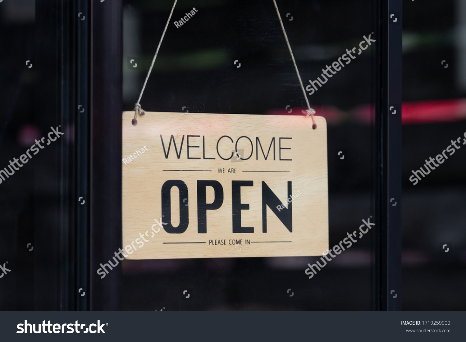 welcome we are open wooden board hanging in front of glass door. notice board of coffee shop. #1719259900