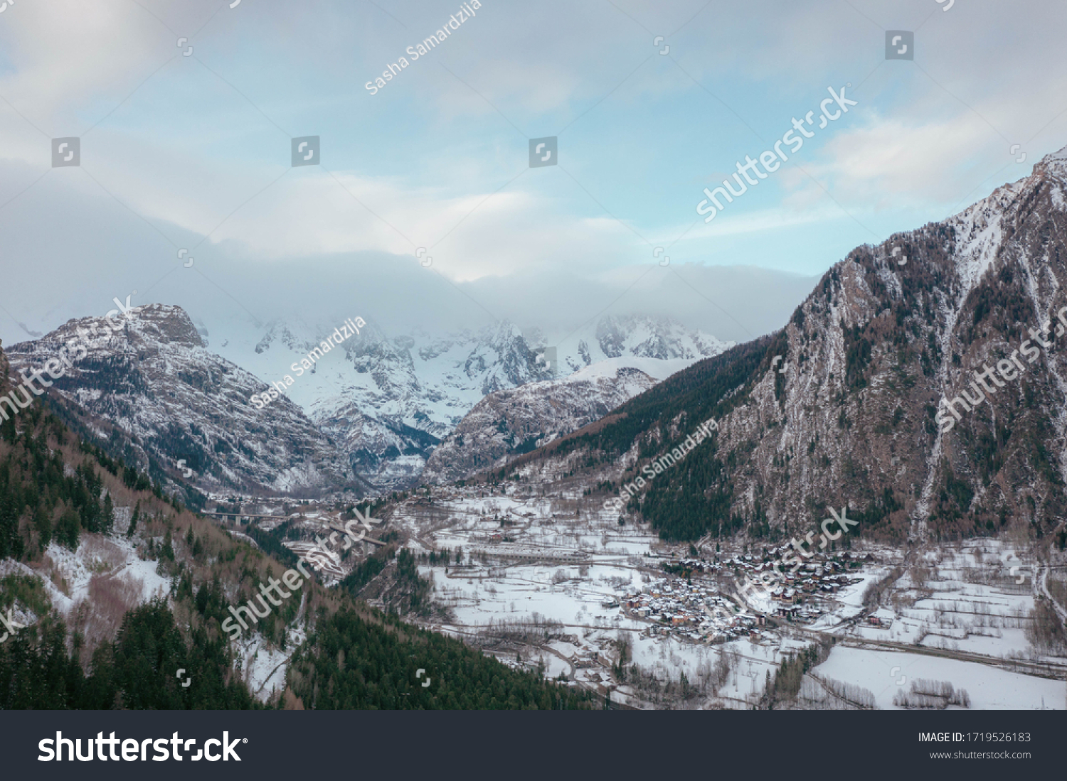 The village Palleusieux under a big mountain, in the Basin Pre-Saint-Didier, Aosta Valley at the time of corona virus outbreak, northern Italy #1719526183