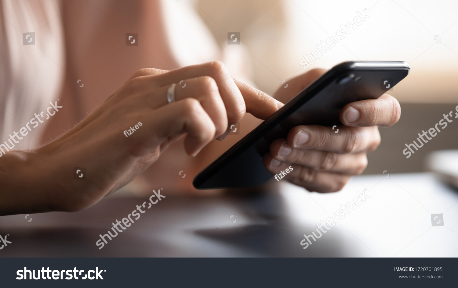 Close up female hands holding phone, typing on screen, young woman using smartphone, chatting in social network, writing message, browsing mobile device apps, blogger posting in blog #1720701895