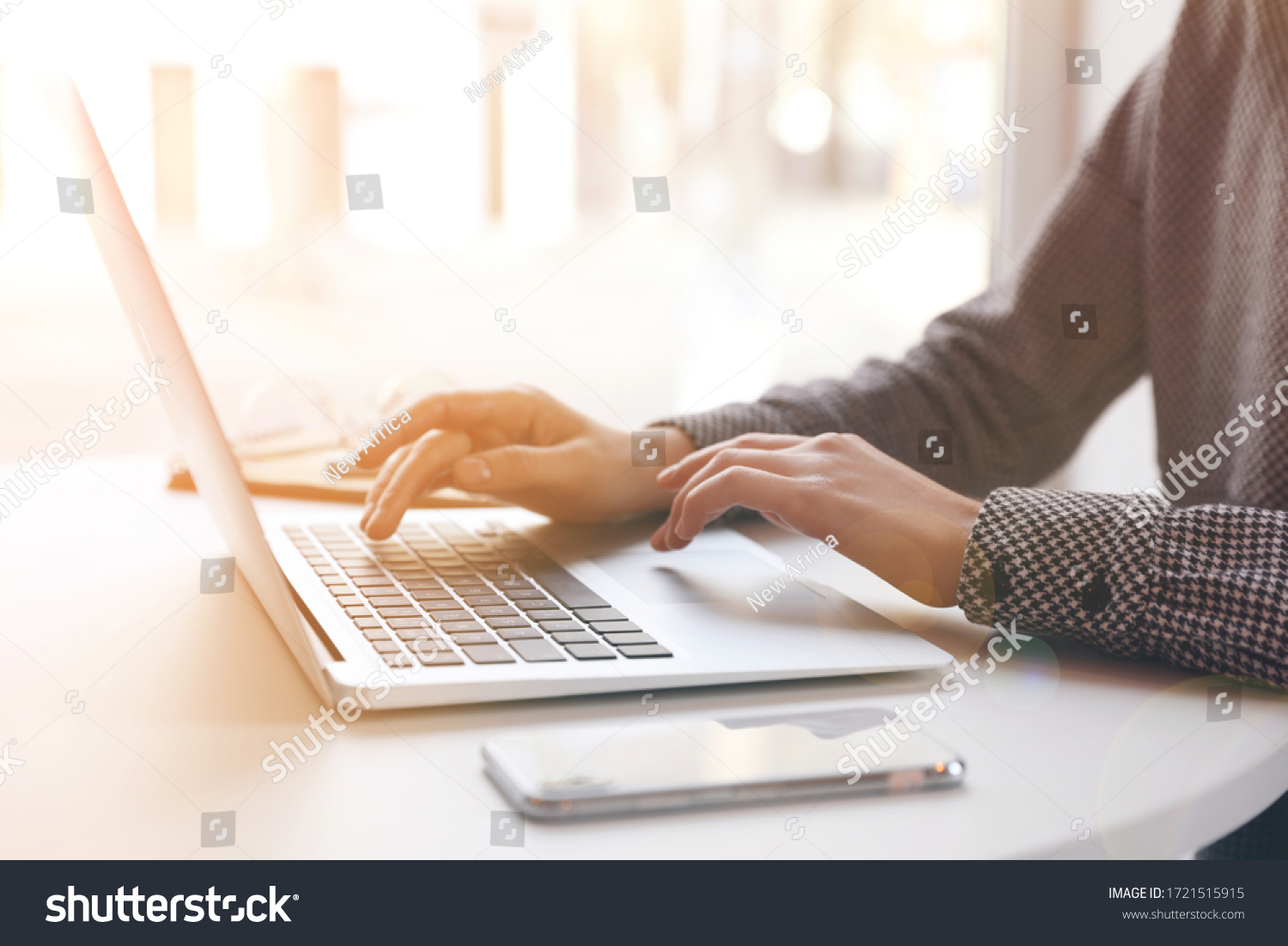 Woman working with laptop at table indoors, closeup #1721515915