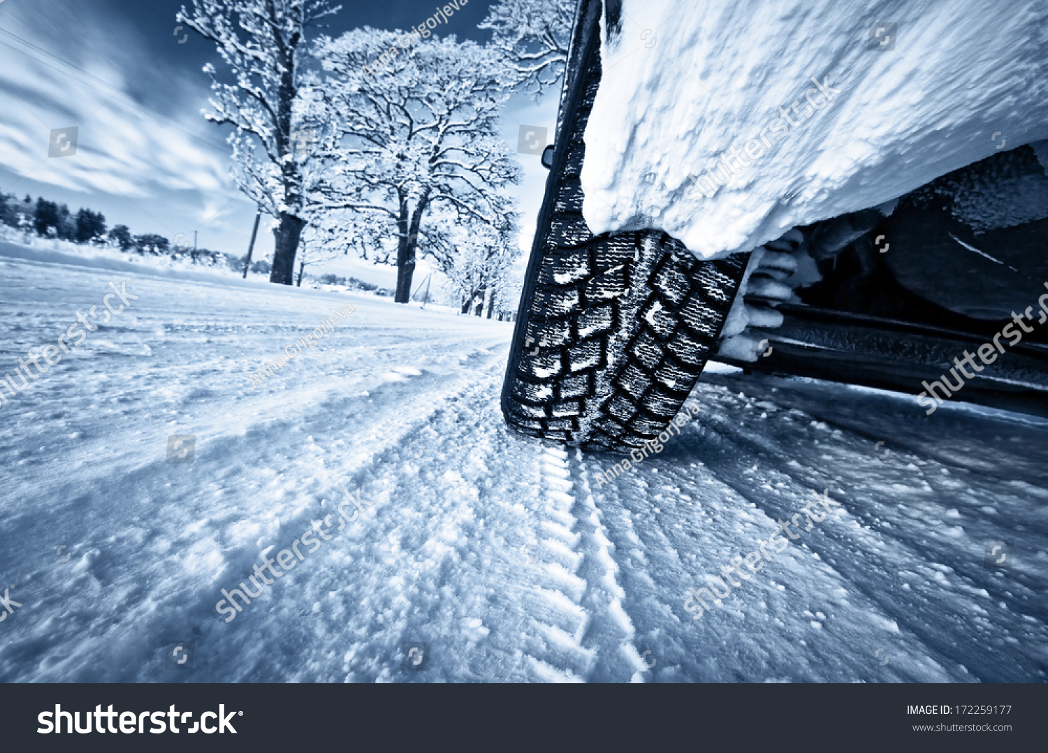 Car tires on winter road #172259177