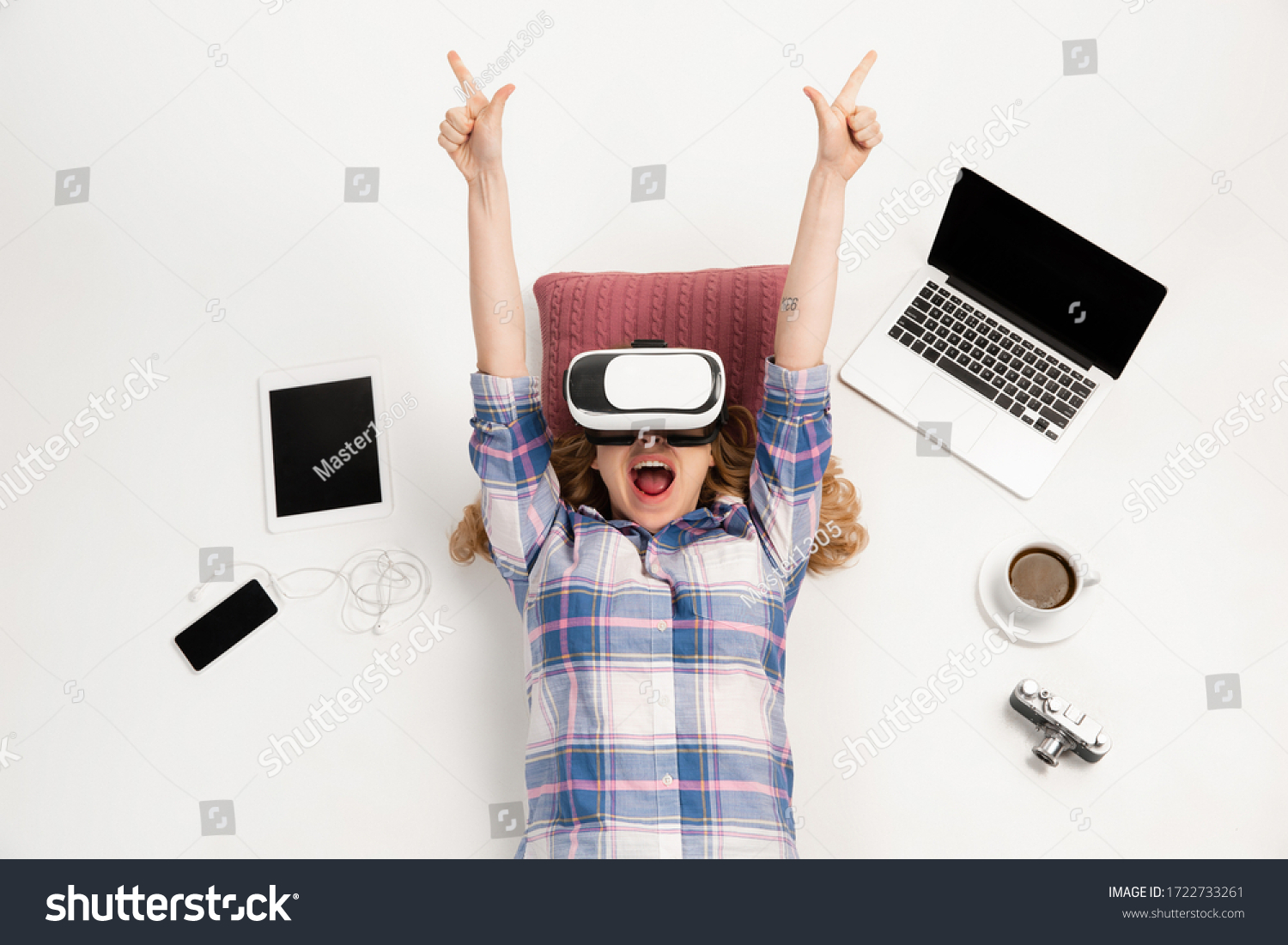 Young caucasian woman using devices, gadgets isolated on white studio background. Concept of modern technologies, gadgets, tech, emotions, ad. Copyspace. Gaming, shopping, meeting online education. #1722733261
