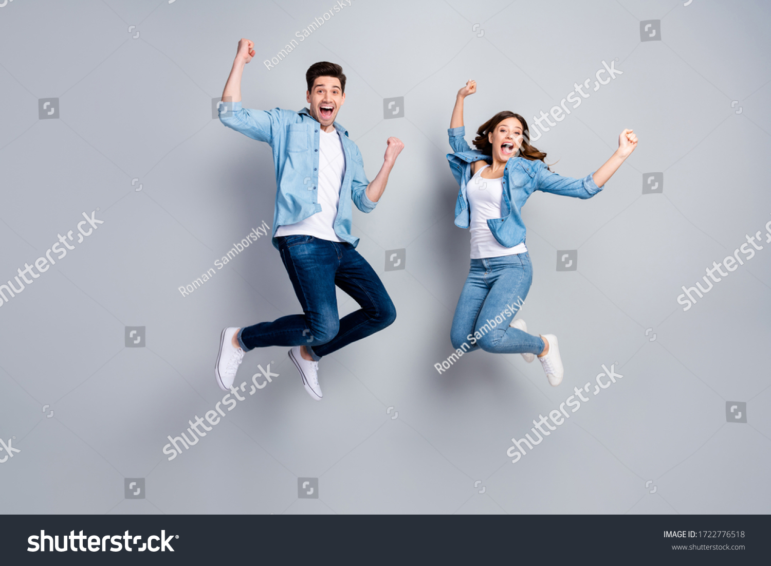 Full body photo of attractive lady handsome funny guy crazy fan jumping high up celebrating football team winning wear casual denim shirts outfit isolated grey color background #1722776518