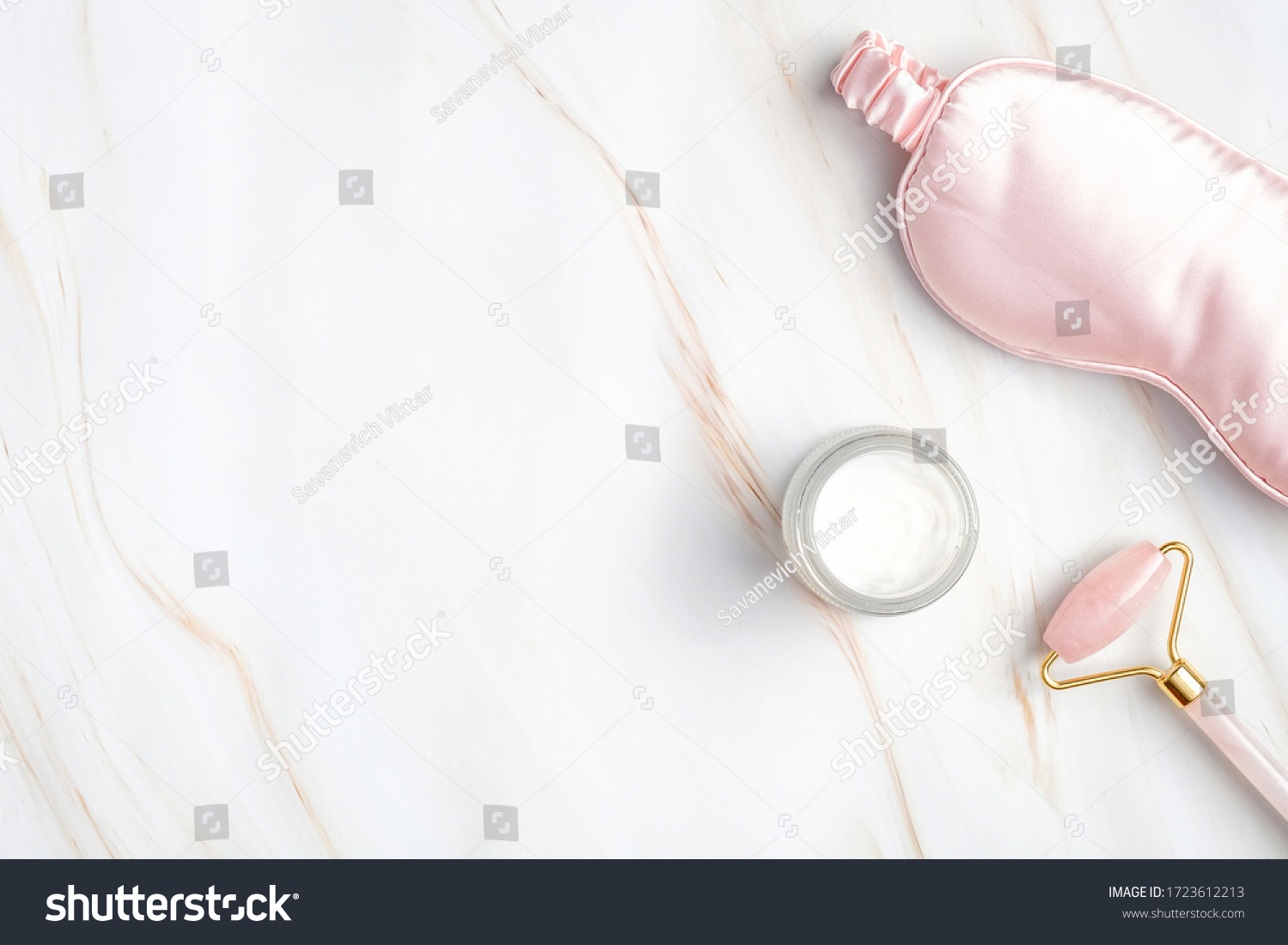 Night care cream for face, sleeping eye mask, facial massage roller on marble background. nighttime skincare routine concept. #1723612213